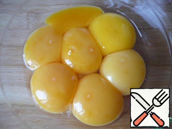 Separate the yolks from the whites. The egg should be at room temperature.
