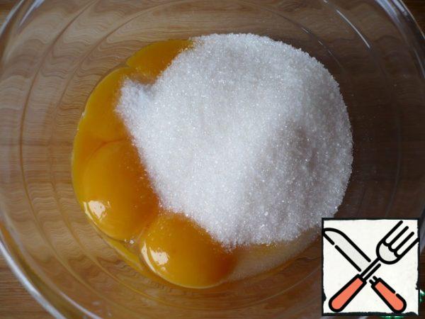 Add salt and sugar to the yolks.
