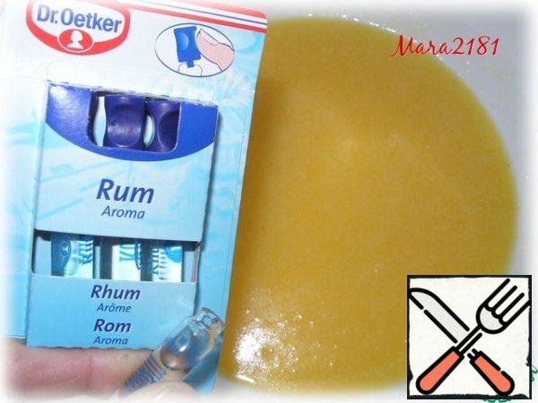 In 100 g of melted butter pour 50 g of sugar and 0.4 tsp salt, stir until dissolved. In warm mixture of add 2 eggs and 0.5 ml flavoring "Rum." Once again, mix thoroughly until smooth.