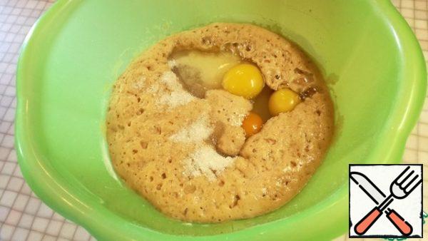 Add warm water, sugar, salt, eggs. Mix everything together.
