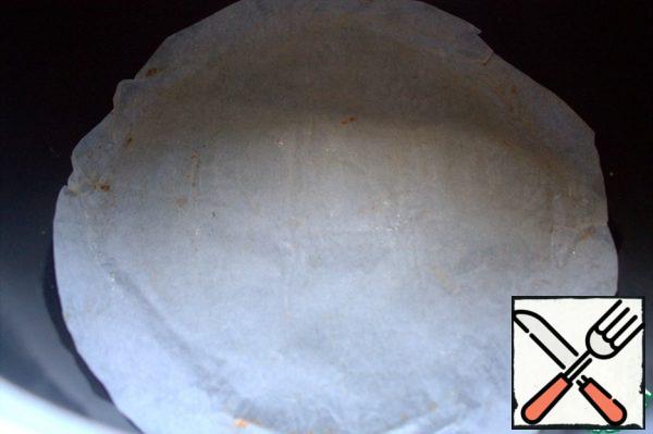 Cover the bottom of the slow cooker with parchment.

