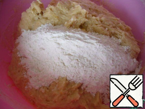 Pour in the remaining flour and continue to knead the dough with your hands.
