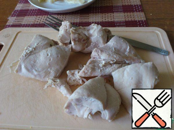 Chicken breast or fillet (as you like) to boil in salted water, disassembled into fibers.