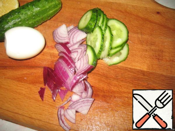 Cucumber, onion, egg cut into.