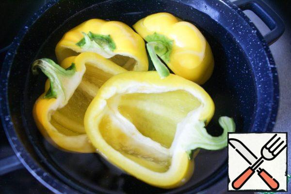 Blanch the peppers in boiling salted water for about 10 minutes, then cool slightly.
