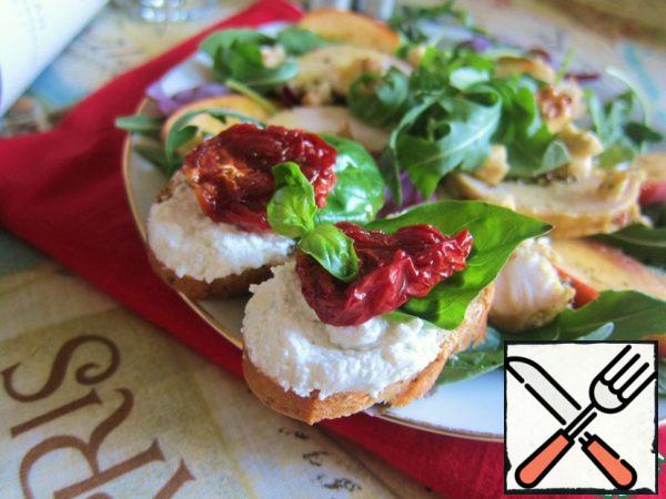 For bruschetta, put cottage cheese, green basil leaves and dried tomatoes on dried bread.
