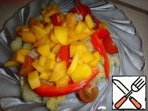 Add mango and pepper.