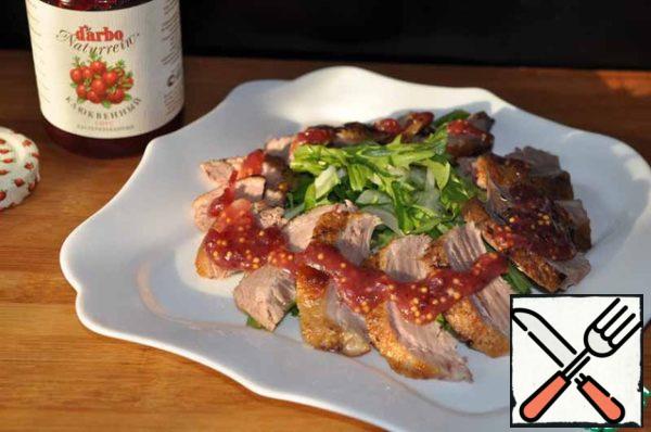 Pour the dressing over the sliced duck breasts.
