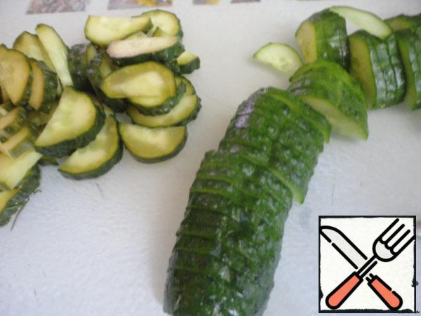 Cucumbers cut into half rings.
