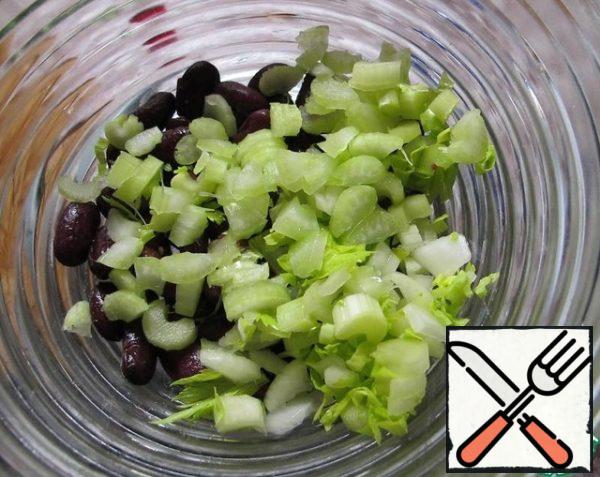 Add the chopped celery to the beans.
