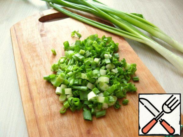 Finely chopped green onions.
