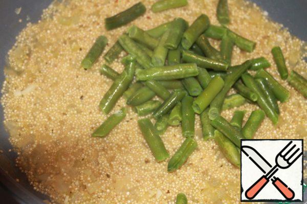 Add the green beans and simmer for 5 minutes.
