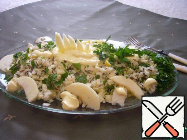 Mix the prepared ingredients well, season with part of the mayonnaise, pour lemon juice.
Before serving, pour the remaining mayonnaise over the salad, lay out the apple slices, sprinkle with finely chopped parsley.