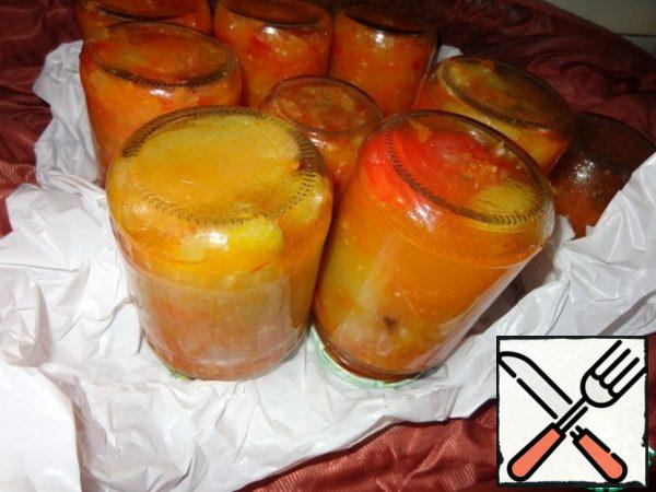 Arrange the peppers in hot sterile jars. I have been sterilizing cans in the oven all my life, covering the grill with napkins, at a temperature of 100 degrees for 20-25 minutes. Cover and just boil for 3-5 minutes. Nothing has ever been damaged or exploded. After turning over, wrap the jars in a fur coat for about a day or as they cool down. I cook them next door to the previous portion of lecho with zucchini. Then send it to the cellar, or refrigerator, or other cool place.