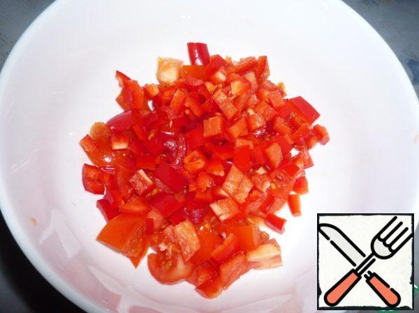 Soak the beans in water overnight. Then cook for about 45 minutes.
Finely chop the tomatoes and peppers.
