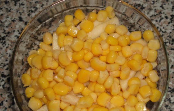 Add corn, pour the dressing.