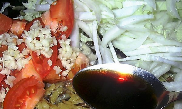 Add soy sauce, sprinkle with black pepper.
