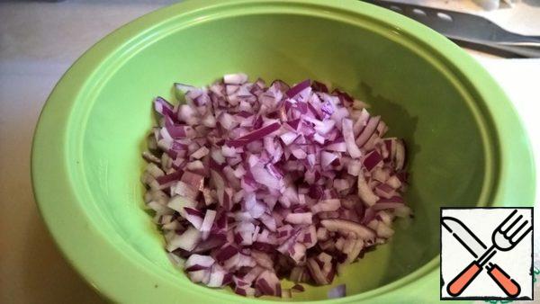 Put the red onion in a bowl. Add salt, sugar and lime juice. Stir and let it brew. Salt and sugar will pull the juice out of the onion and compensate for the bitterness
