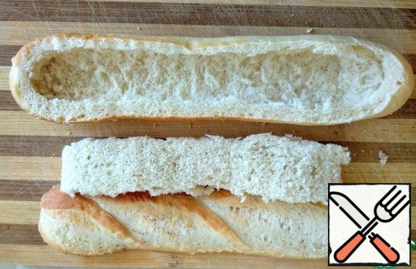 Cut off the top of the baguette and remove the crumb.

