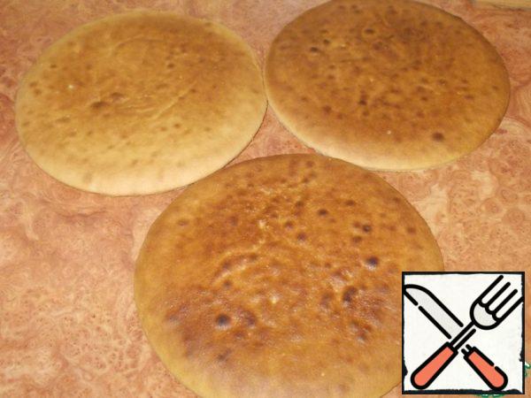 That's how we bake all three cakes. Stack them, wrap them in a towel and leave them to rest.
