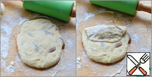 Roll out each piece into an oval. Press one edge of the oval to the middle...

