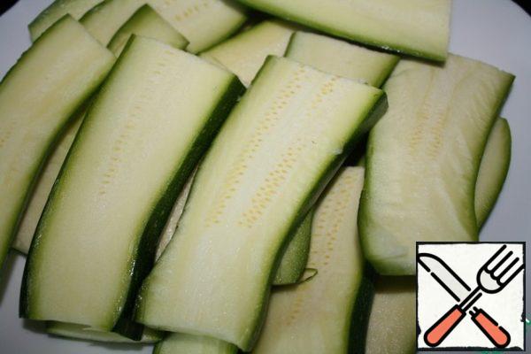 My zucchini are small and they need to be cut in half, and then cut each half into slices.
