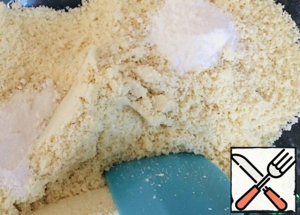 In a bowl, mix almond flour with vanilla sugar and baking powder, mix.

