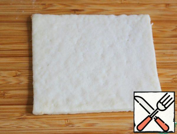Roll out the dough into a thin layer and cut out the squares - I have 10x10 cm.