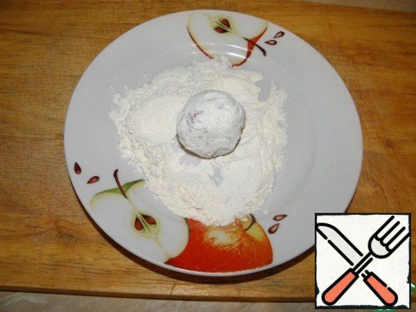 Roll the balls in flour
