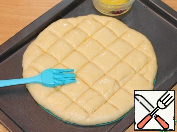 Then brush the dough generously with garlic butter.
