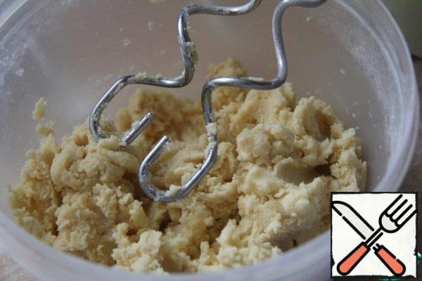 To knead the dough, put the flour, butter and sugar in a food processor and whisk until the mixture looks like crackers. Add a small amount of water, about a teaspoon, and continue stirring until the mixture comes together into a ball.
