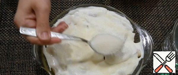 Spread the top of the pancakes with sour cream and sprinkle with sugar. Cover with a lid or foil and put in the oven for 40-50 minutes at 180 degrees.
