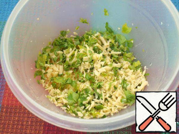Grate the hard cheese separately and mix it with chopped parsley.
