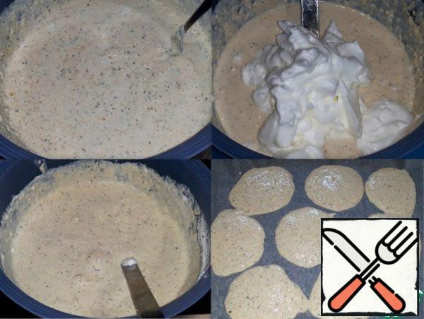 The mass is mixed. I poured butter into it, put
the beaten egg whites and poured a handful of nuts and again
stirred. The consistency of the dough turned
out to be like a thick batter. Preheat the oven to 180 degrees.
The baking sheet was covered with parchment paper and the dough was poured
on it in the form of round pancakes, leaving
a small space between them so that the pancakes did not stick together.
