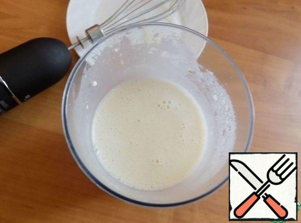 In the bowl in which I will knead the dough, pour sour milk. Milk can be replaced with curdled milk. All the ingredients for the dough will be sent by email. Corolla. Pour baking soda into the sour milk, stir. I'm out of soda. Added sugar, salt, eggs, mixed. I love sweet pancakes, so the amount of sugar should be selected according to your taste. Sift the flour, combine it together. The dough turned out thick, not for thin pancakes. Constantly working with a whisk, pour boiling water. Now we have dough for thin pancakes. I poured sunflower oil into the dough so as not to lubricate the mold for each pancake. It's done.
