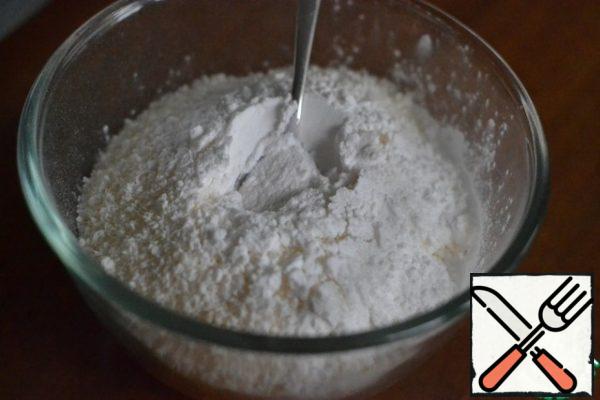 In a separate bowl, mix flour, coconut chips, starch and baking soda.
