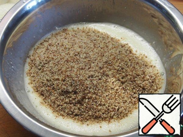 Add ground nuts and flour to the resulting mass, mix. Instead of hazelnuts, you can use almonds, in this case, use ordinary white sugar, and instead of rum, it is better to add vanilla sugar, but the taste, of course, will be completely different.
