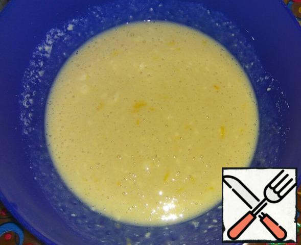 Add the remaining warm milk, sugar, zest of one lemon and salt to the dough and mix.