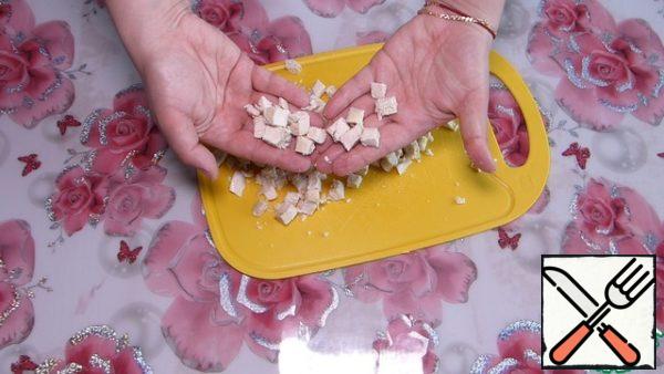 Boiled chicken breast cut into small cubes.
