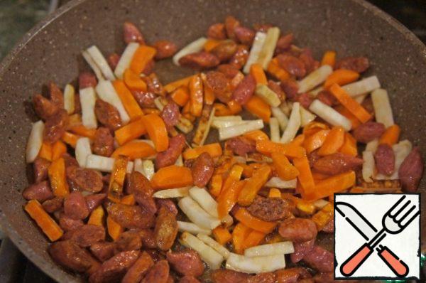Add the carrots and celery and fry a little.
