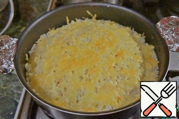 Hold it until the cheese melts and lightly browns.
