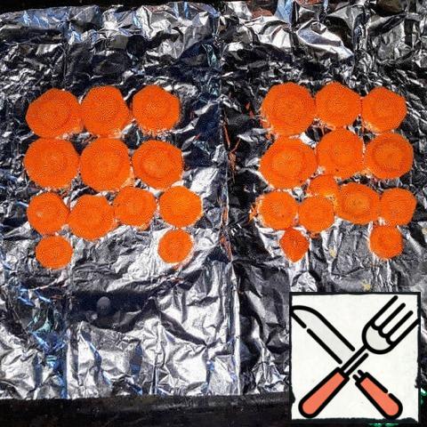 Chop the carrots into circles and place on foil;