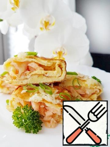 Cut the omelet into portions, sprinkle with fresh herbs and serve.
