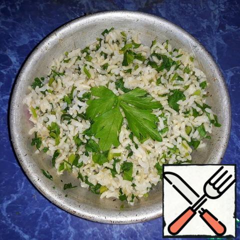 Pour the greens into the finished rice and mix thoroughly;