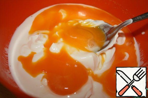 Separate the yolks from the proteins and mix them with yogurt or thick sour cream.