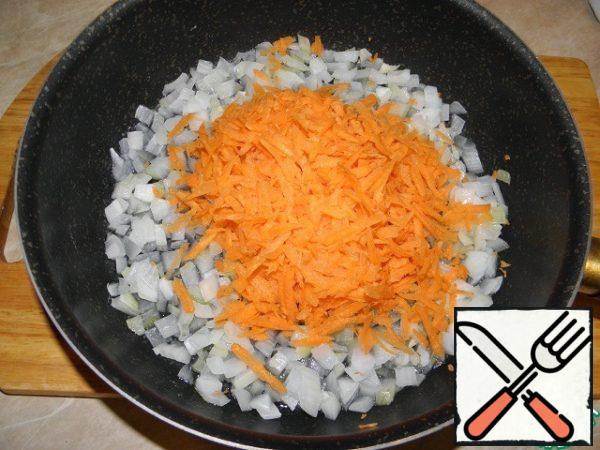 Grate the carrots and add to the onion