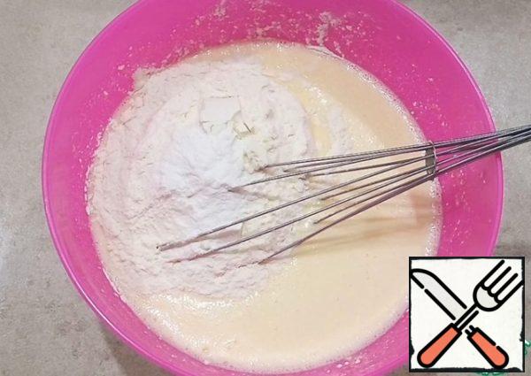 Add flour, baking powder and mix everything.