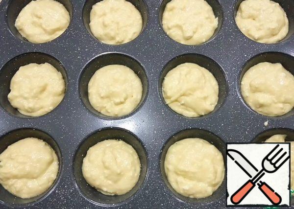 Molds grease with vegetable oil and spread 1 tbsp of dough. Send in a preheated oven at 180 degrees for 25-30 minutes.