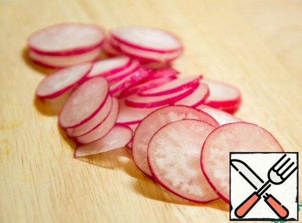Radish cut into thin slices.
