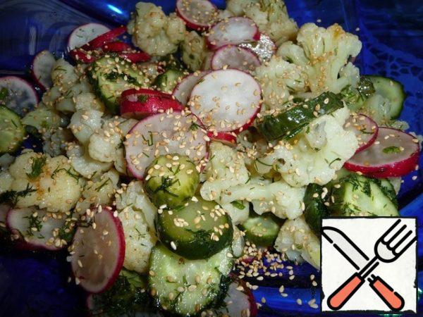 Lightly fry the sesame seeds, cool and add to the salad.